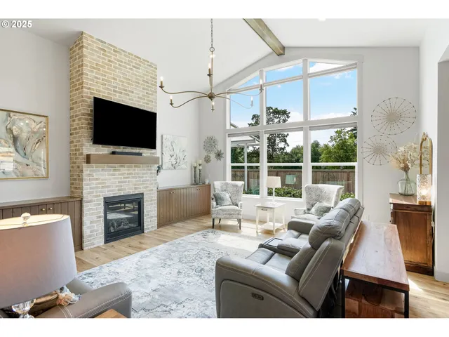 a living room with furniture a fireplace and a flat screen tv