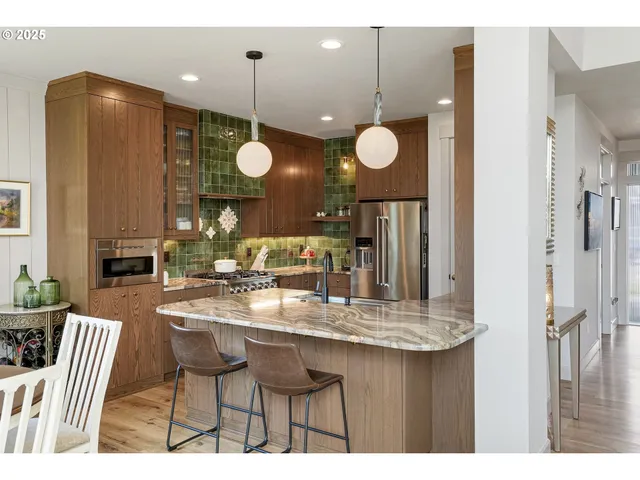 a kitchen with a dining table and chairs