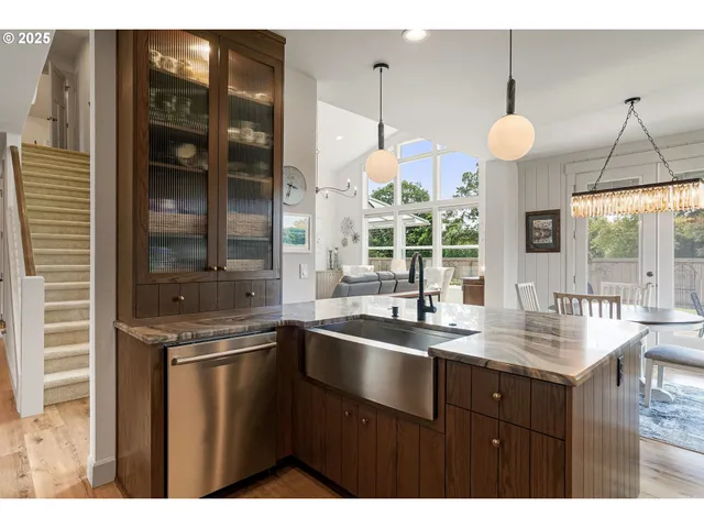 a kitchen with a sink a counter space and a window