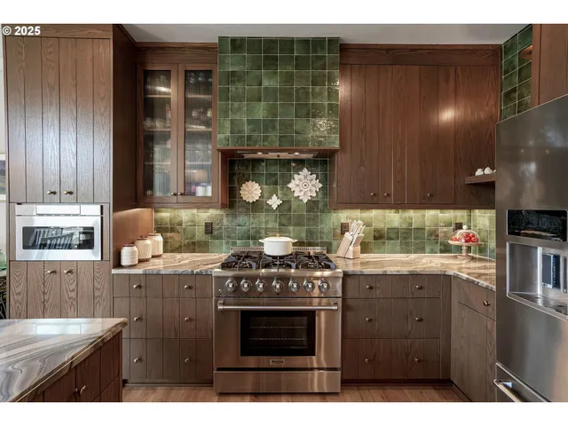 a kitchen with a stove and cabinets