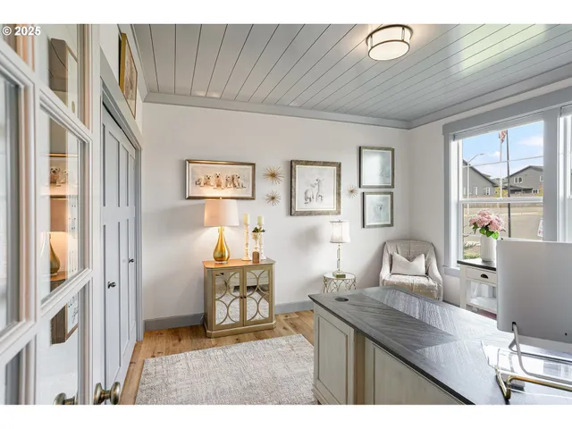 a kitchen with granite countertop a sink and a refrigerator
