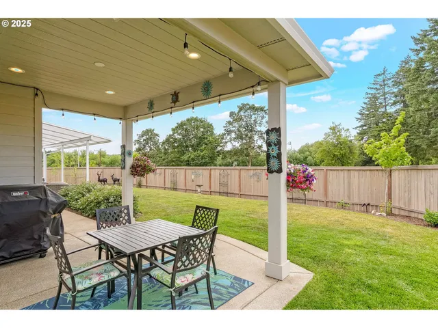 a patio with table and chairs