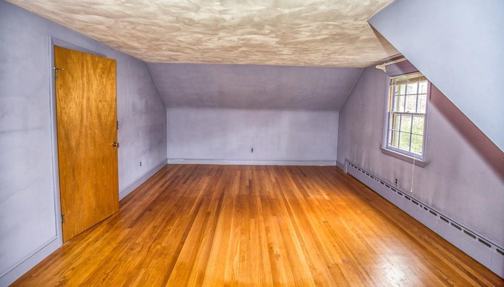 154 Prouty Street Springfield, MA 01119 - Photo 16 of 26 a view of a room with wooden floor and staircase