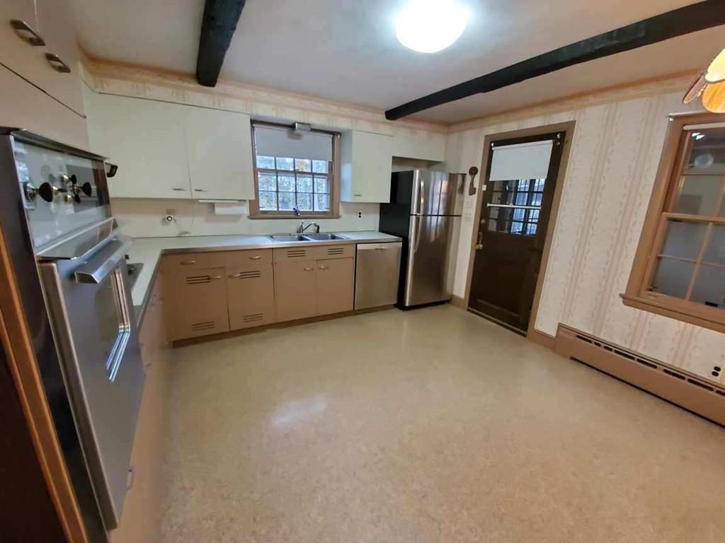 154 Prouty Street Springfield, MA 01119 - Photo 7 of 26 a kitchen with refrigerator and window
