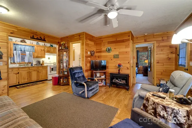 a living room with fireplace furniture and a fireplace