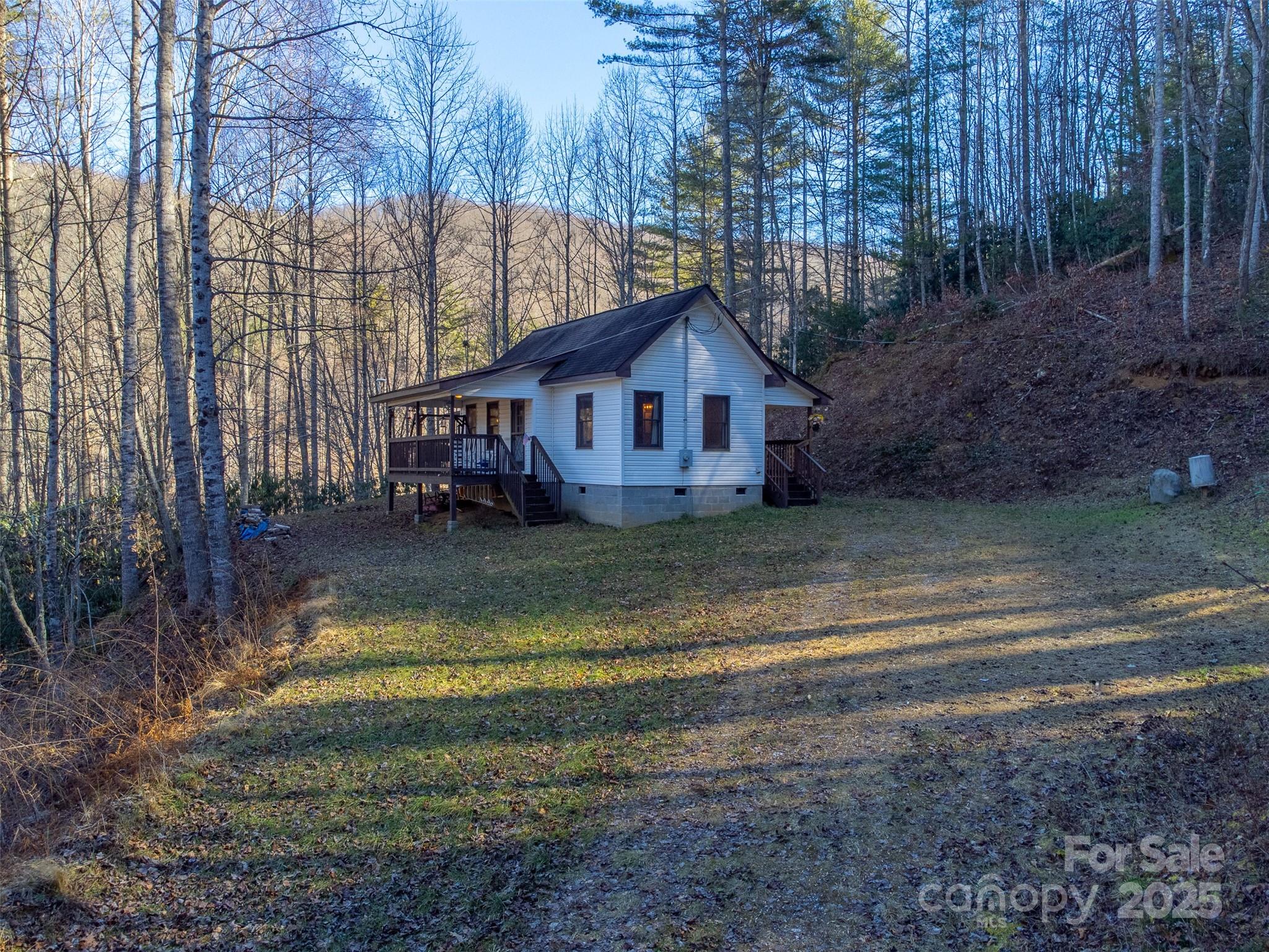109 Hog Cove Road Sylva, NC 28779 - Photo 2 of 48 a view of a house with a yard