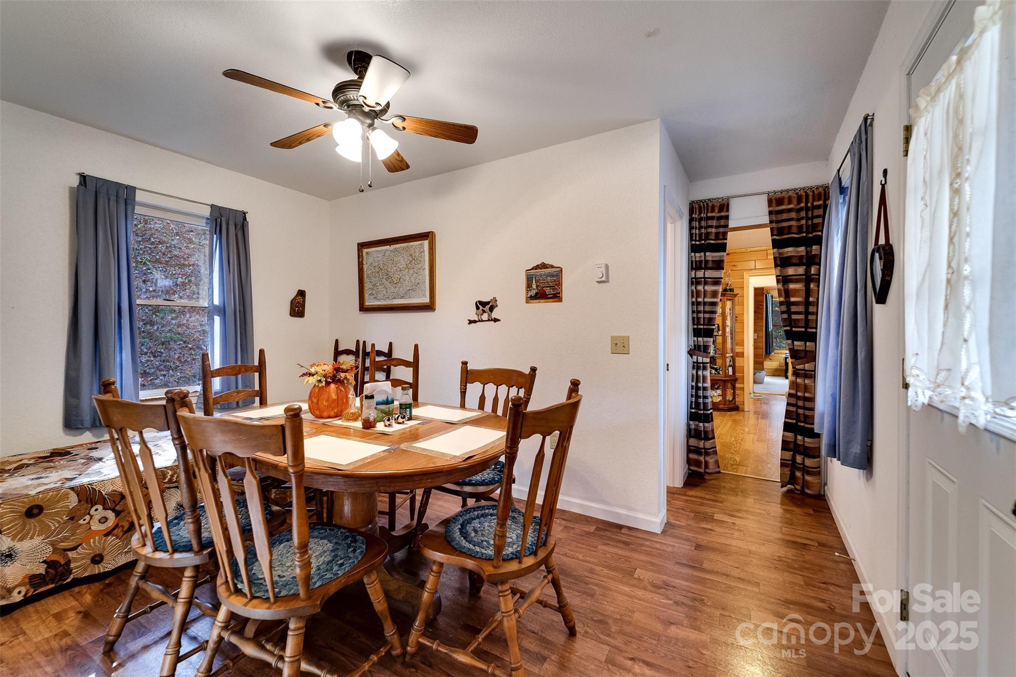 109 Hog Cove Road Sylva, NC 28779 - Photo 21 of 48 a view of a dining room with furniture and wooden floor
