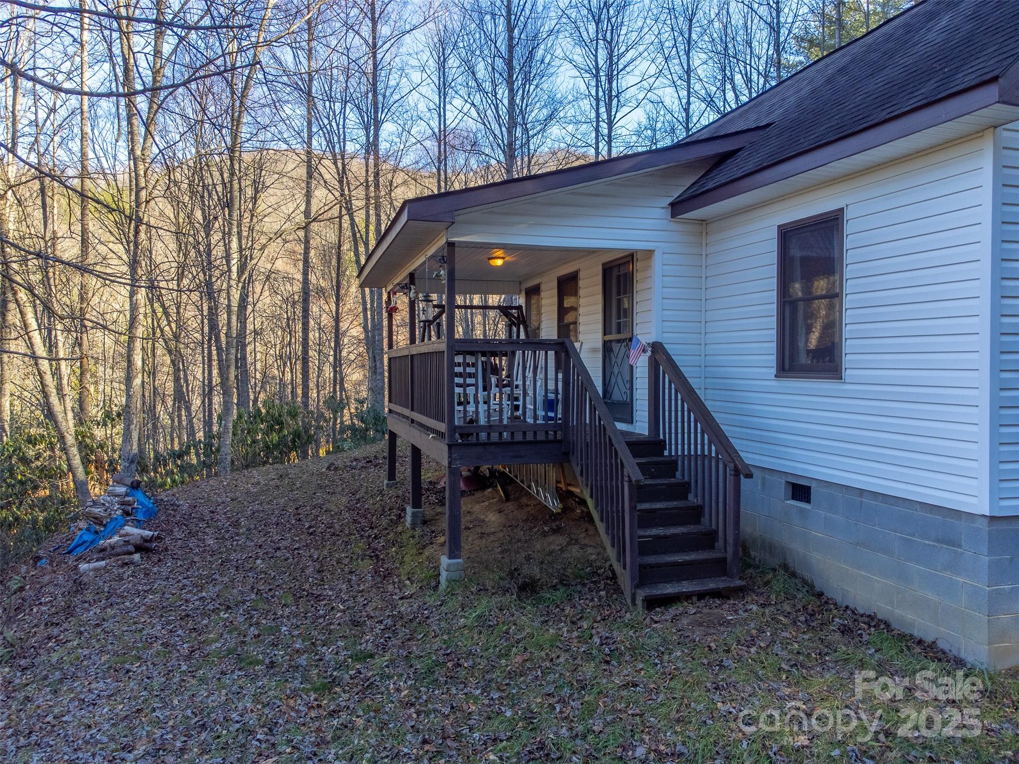 109 Hog Cove Road Sylva, NC 28779 - Photo 31 of 48 a view of a wooden bench sitting in middle of a yard