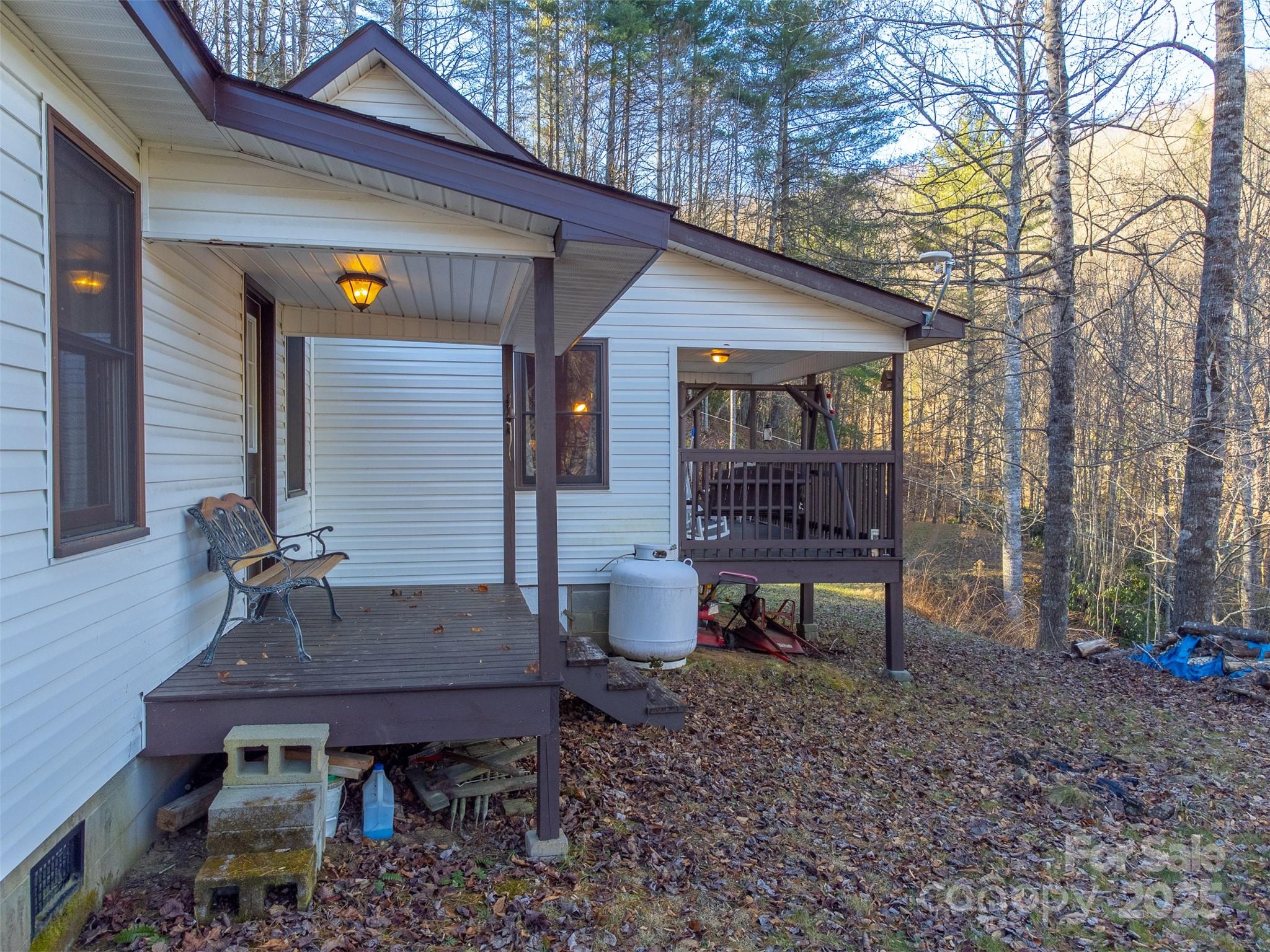 109 Hog Cove Road Sylva, NC 28779 - Photo 35 of 48 a table and chairs sitting in backyard of house