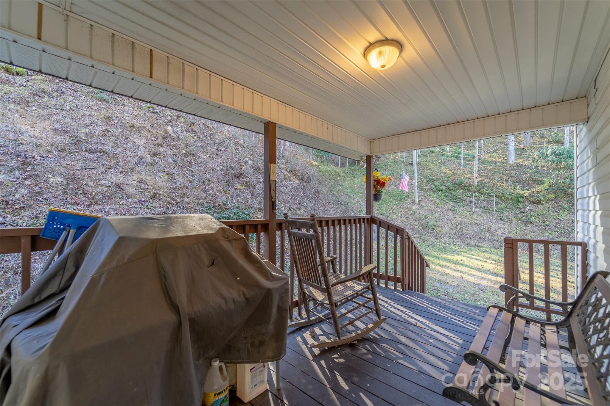 109 Hog Cove Road Sylva, NC 28779 - Photo 8 of 48 a view of a balcony with chairs
