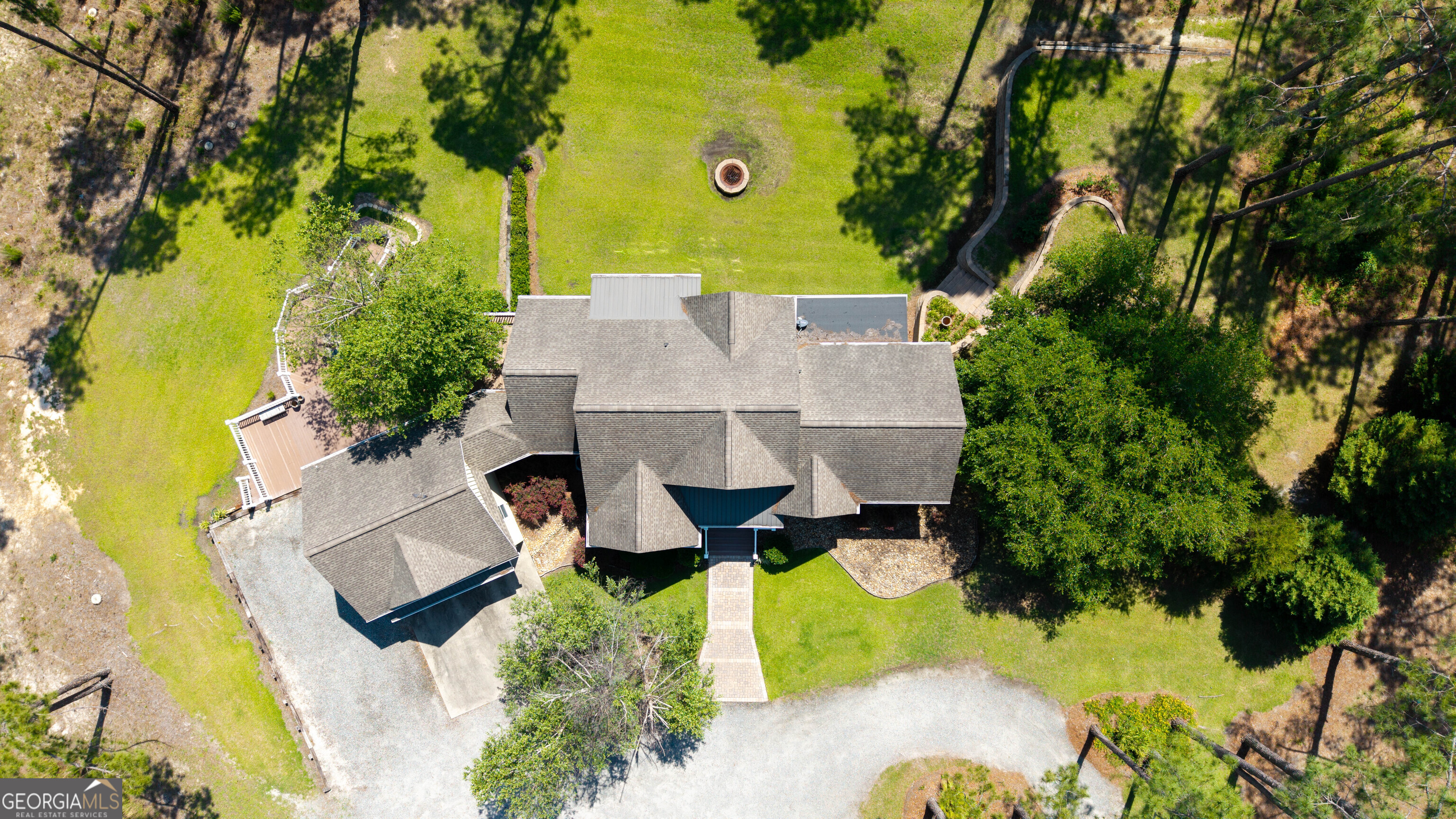 300 Hammond Powell Road Hazlehurst, GA 31539 - Photo 6 of 91 an aerial view of a house with swimming pool and large trees