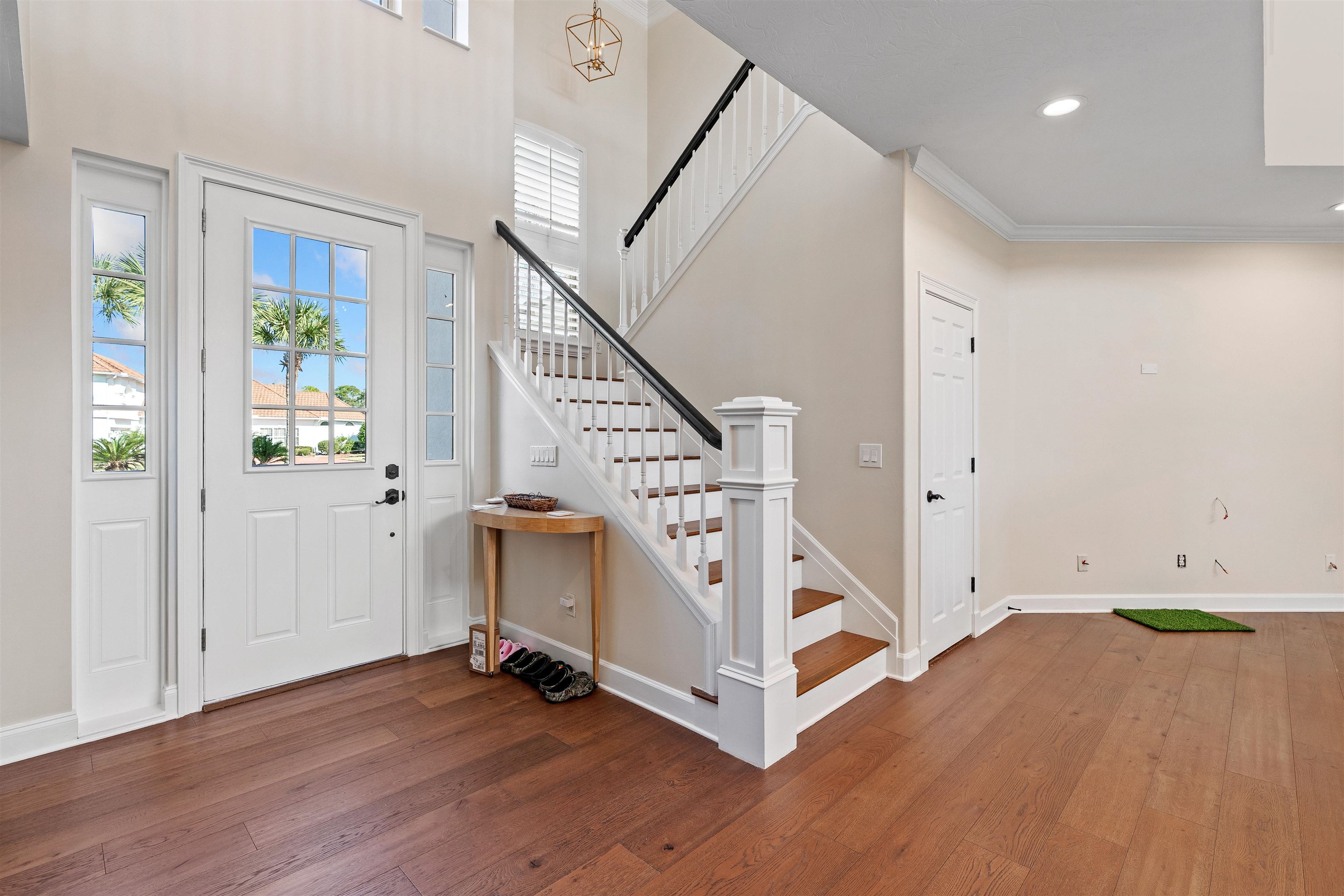 207 Marshside Drive St. Augustine, FL 32080 - Photo 12 of 87 a view of an entryway with wooden floor and front door