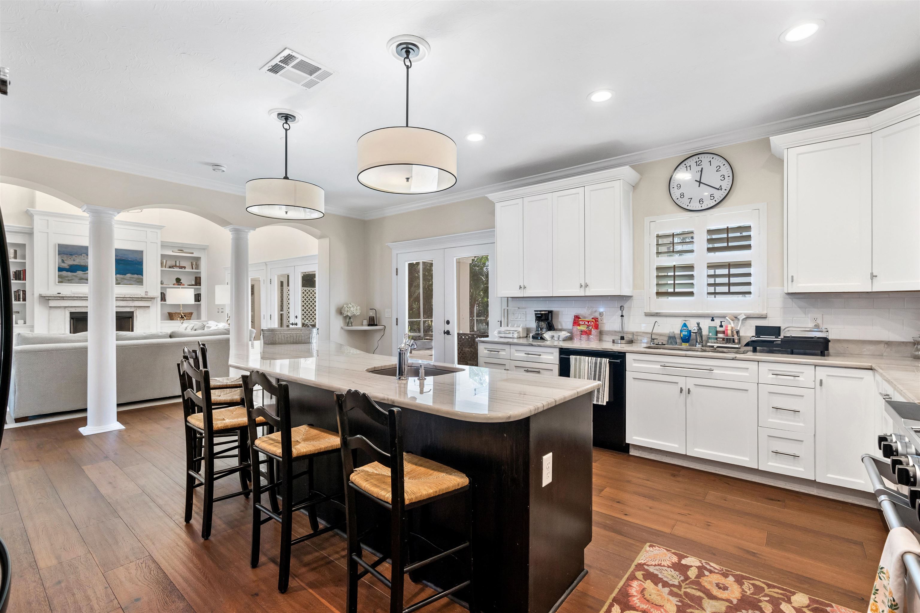 207 Marshside Drive St. Augustine, FL 32080 - Photo 86 of 87 Kitchen with ornate columns, french doors, a kitchen bar, hanging light fixtures, and open floor plan