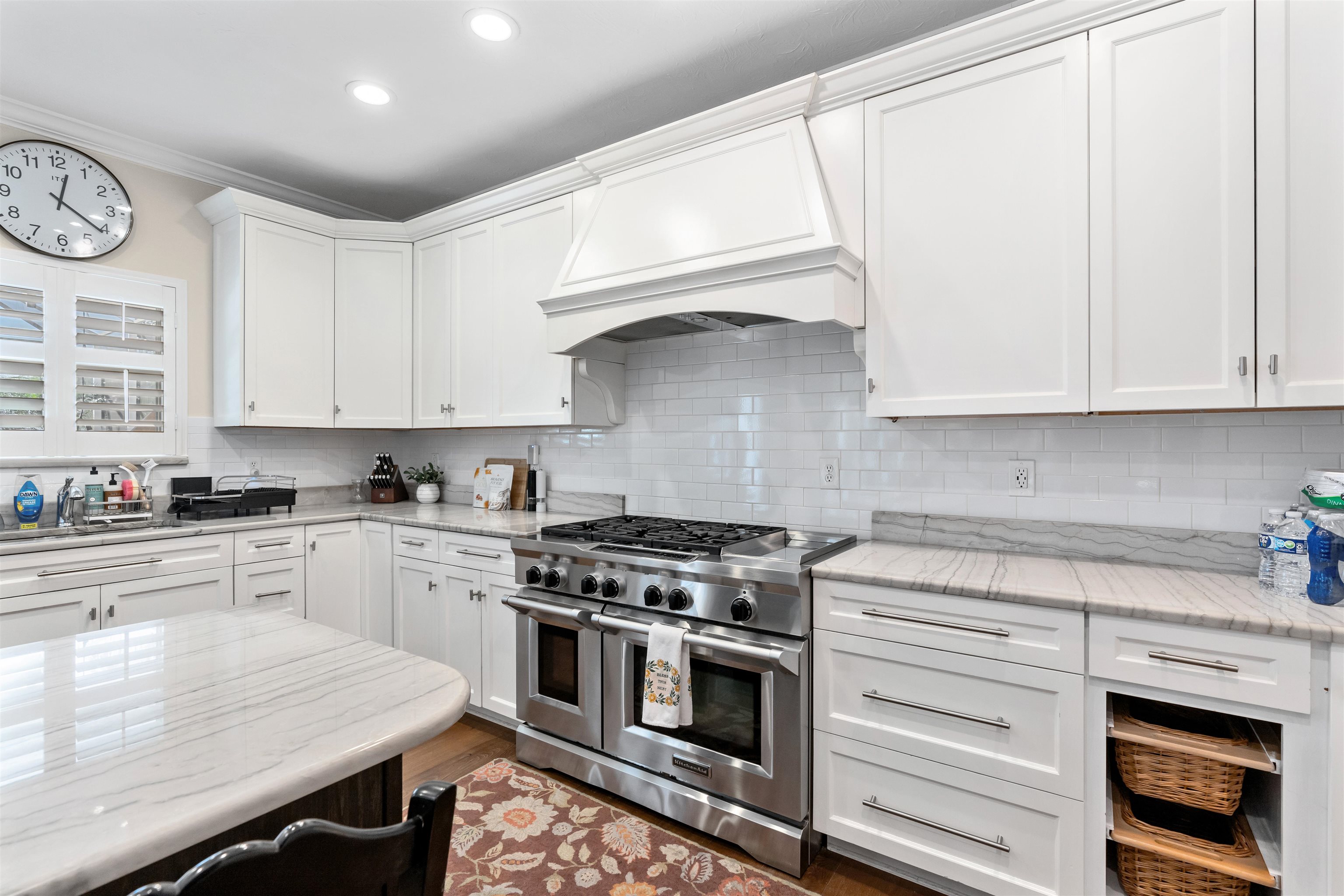 207 Marshside Drive St. Augustine, FL 32080 - Photo 20 of 87 Kitchen featuring double oven range, white cabinets, custom exhaust hood, light stone countertops, and recessed lighting