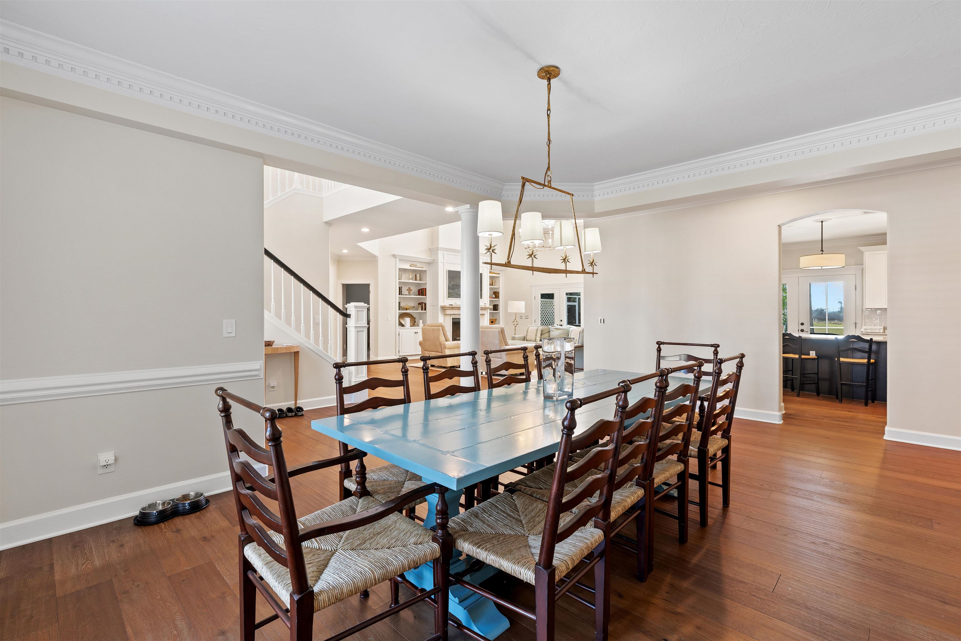 207 Marshside Drive St. Augustine, FL 32080 - Photo 24 of 87 a view of a dining room and livingroom with furniture wooden floor a chandelier