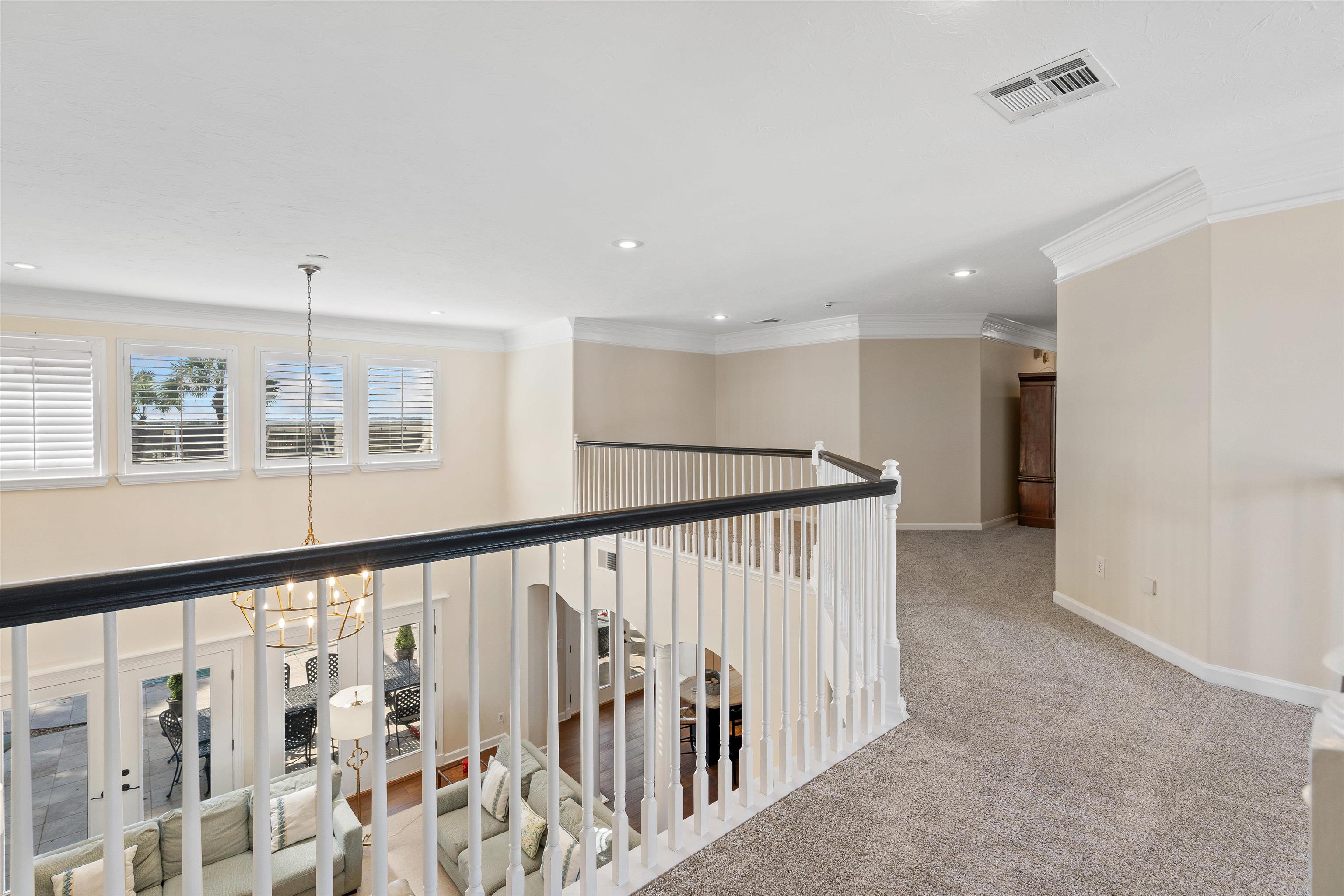 207 Marshside Drive St. Augustine, FL 32080 - Photo 26 of 87 a view of a hallway with wooden floor and staircase
