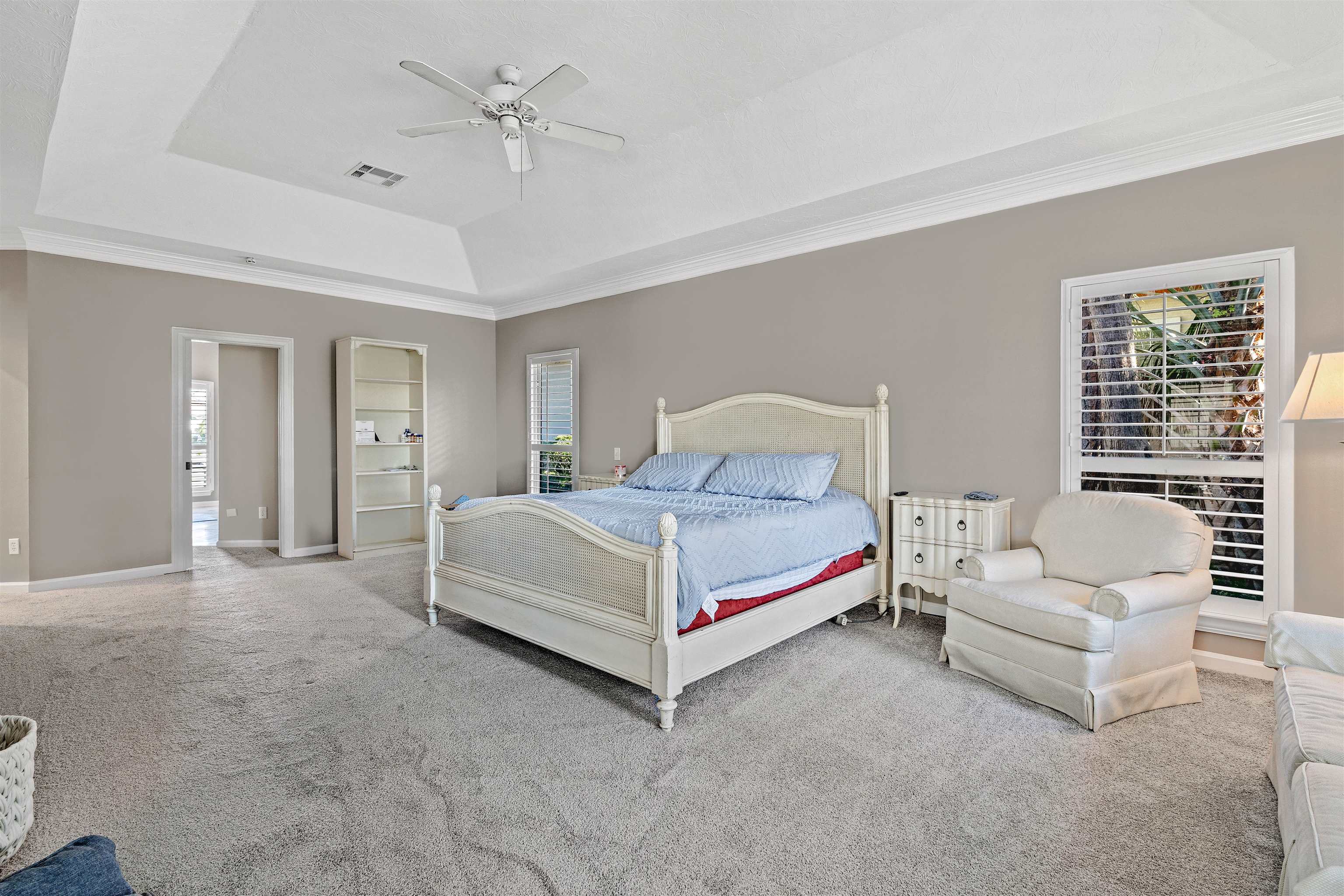 207 Marshside Drive St. Augustine, FL 32080 - Photo 28 of 87 a bedroom with a bed lamp closet and large window