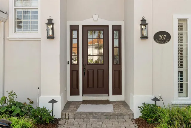 an aerial view of a house with outdoor space and lake view