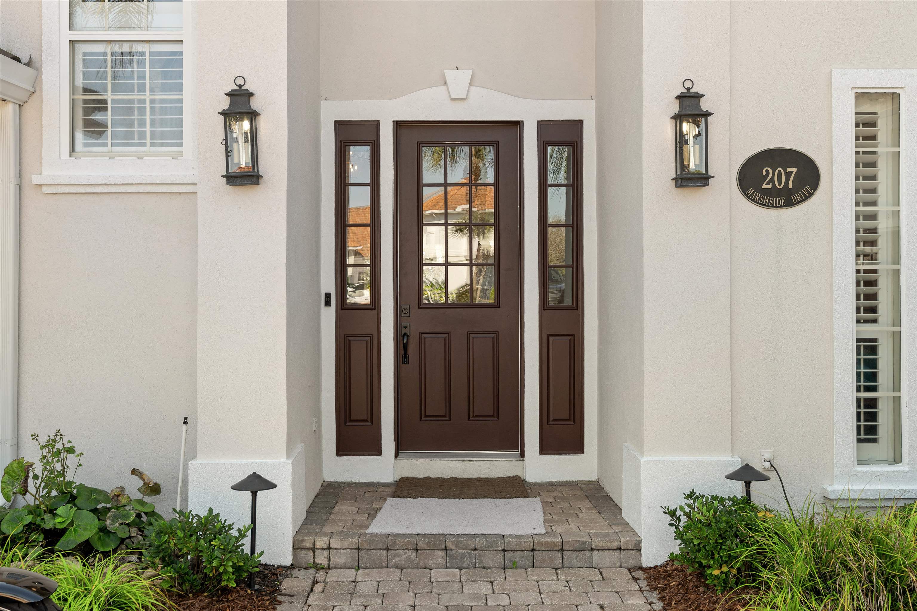 207 Marshside Drive St. Augustine, FL 32080 - Photo 3 of 87 View of exterior entry featuring stucco siding