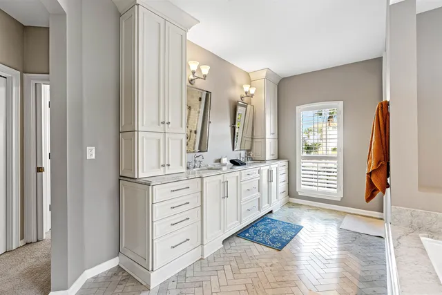 a living room with furniture workspace and a ceiling fan
