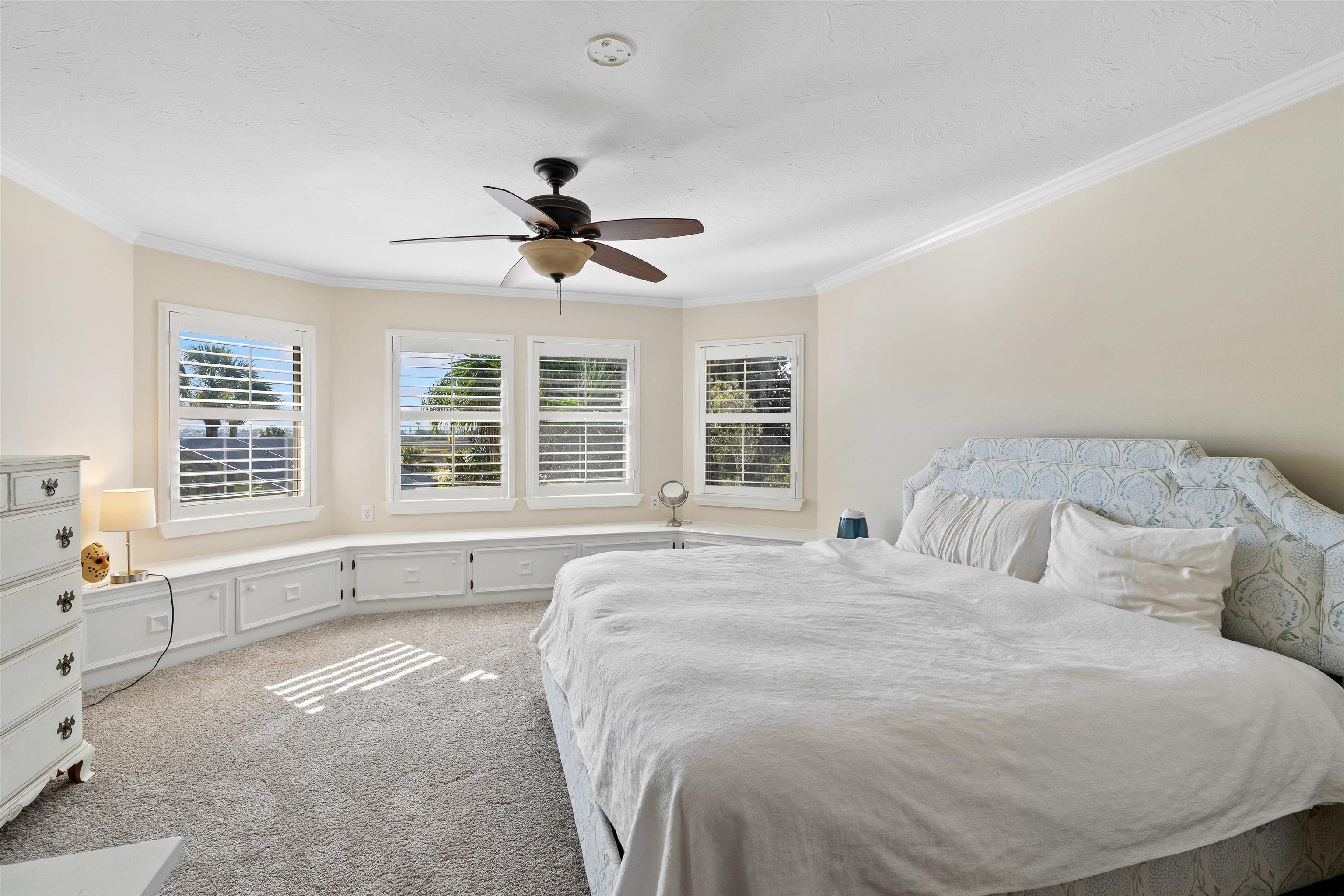 207 Marshside Drive St. Augustine, FL 32080 - Photo 40 of 87 a spacious bedroom with a large bed and windows