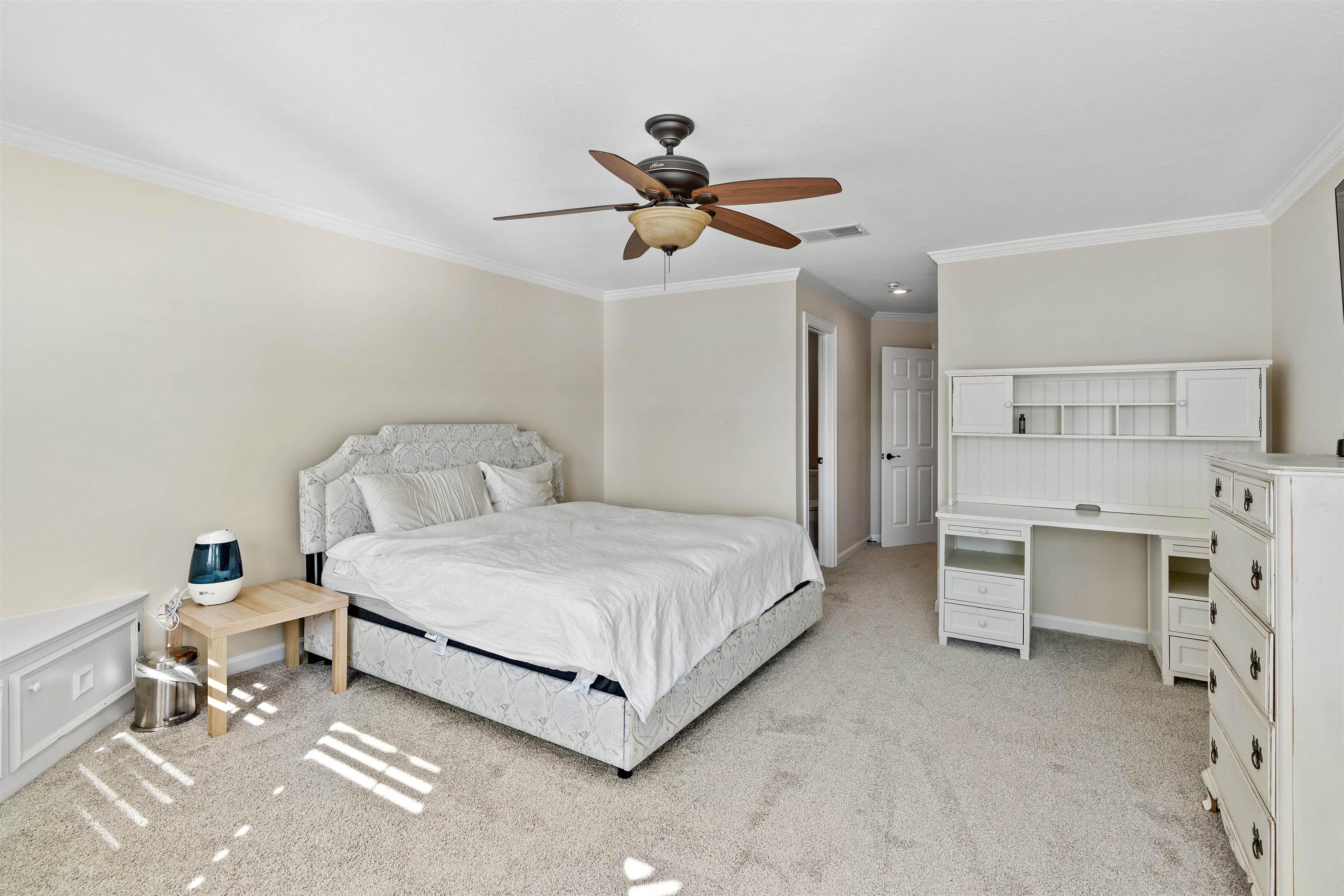 207 Marshside Drive St. Augustine, FL 32080 - Photo 41 of 87 Bedroom featuring crown molding, light carpet, ceiling fan, and a desk