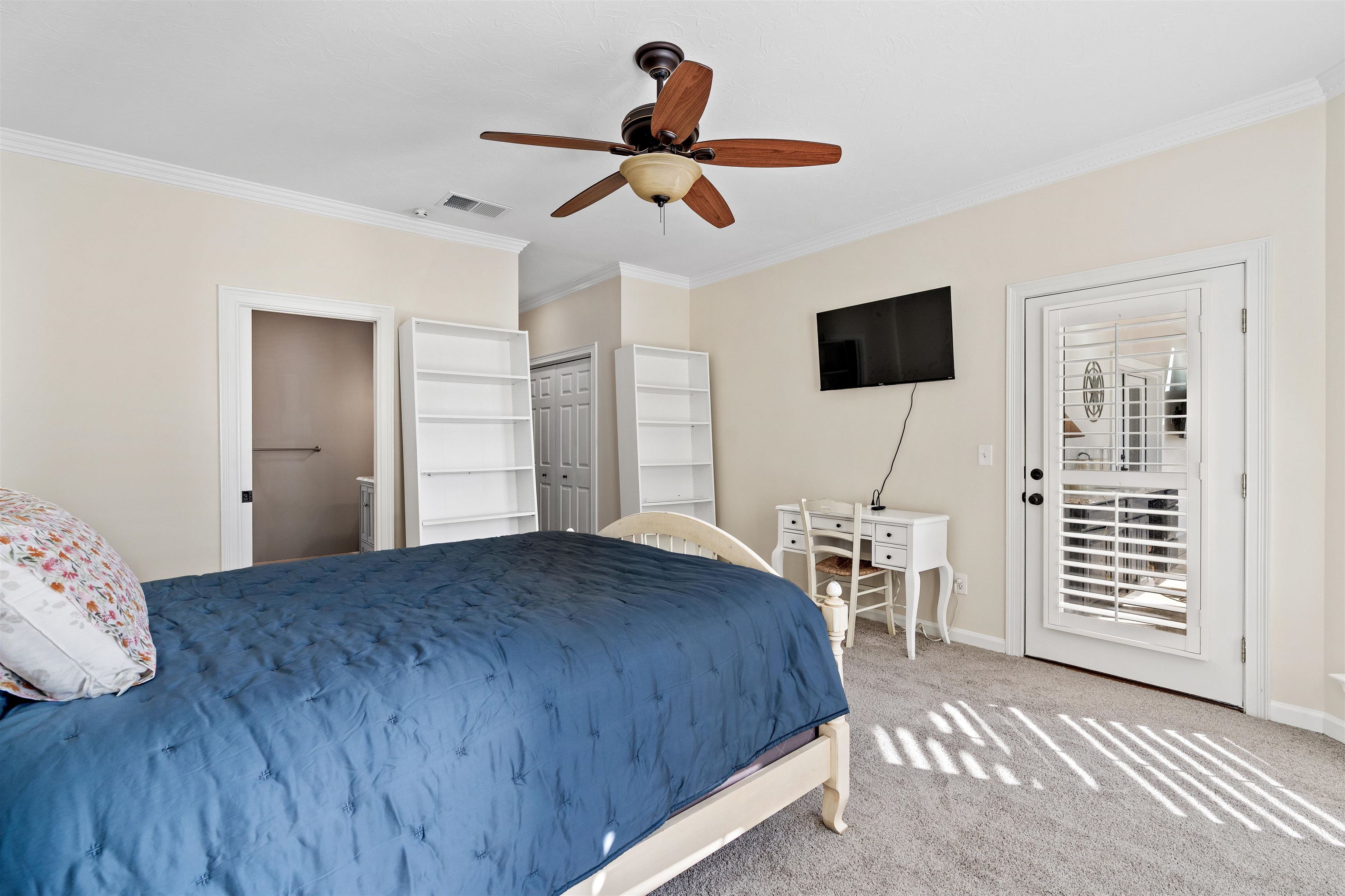 207 Marshside Drive St. Augustine, FL 32080 - Photo 44 of 87 a bedroom with a bed and a flat screen tv