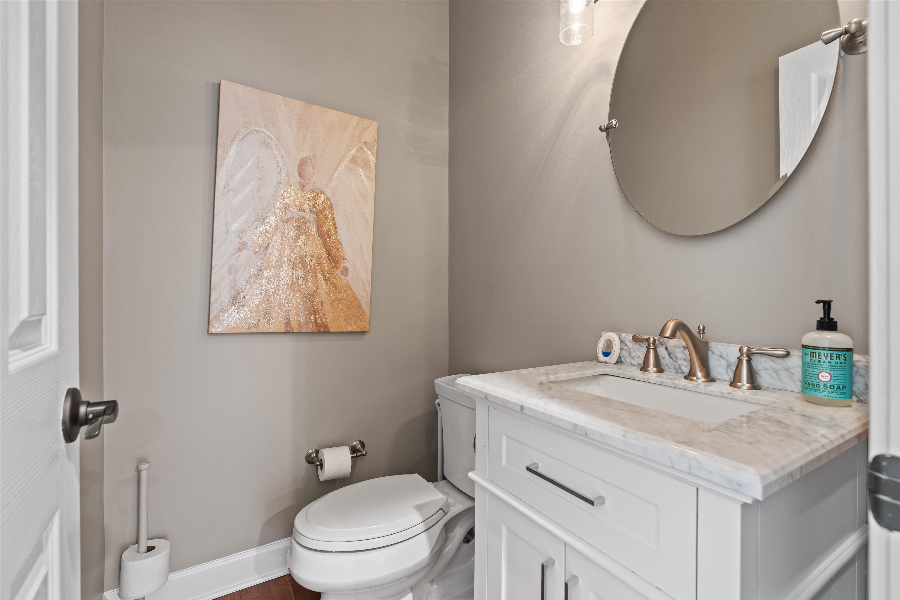 207 Marshside Drive St. Augustine, FL 32080 - Photo 47 of 87 a bathroom with a toilet sink vanity and mirror