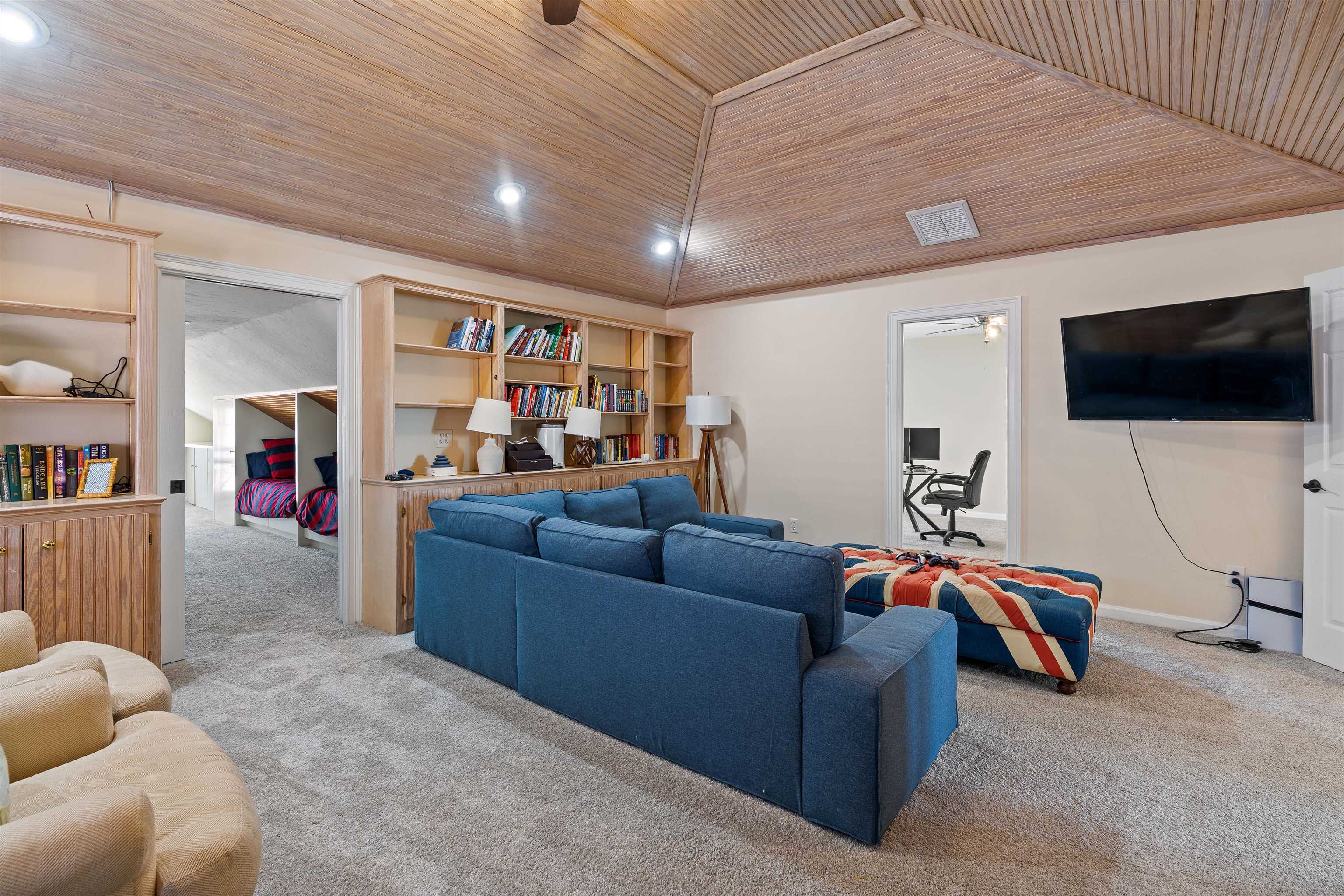 207 Marshside Drive St. Augustine, FL 32080 - Photo 49 of 87 a living room with furniture and a flat screen tv