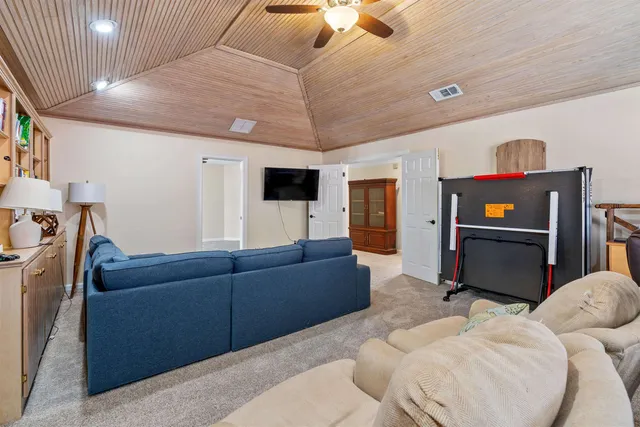 an aerial view of a house with a swimming pool