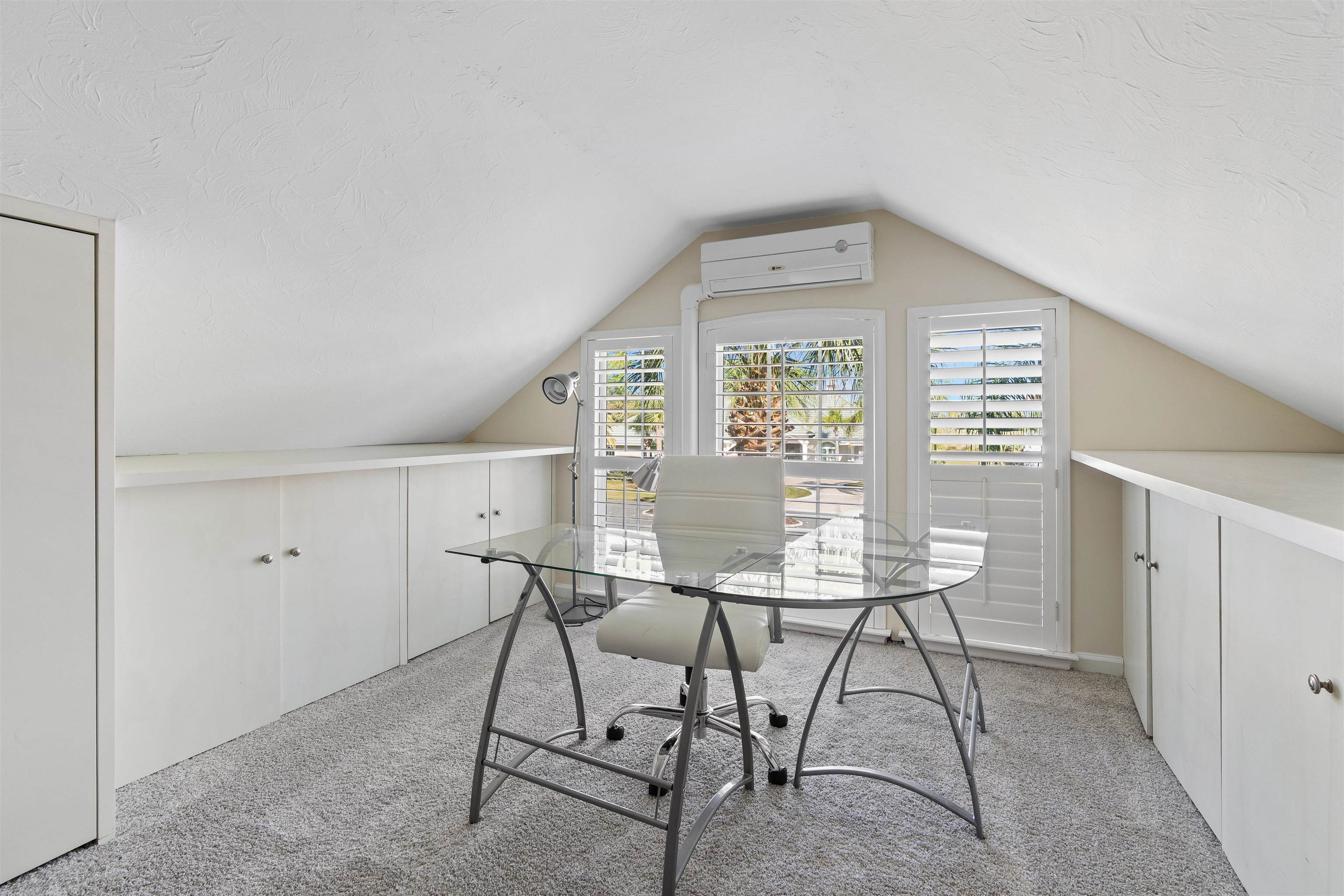 207 Marshside Drive St. Augustine, FL 32080 - Photo 53 of 87 Office area with light carpet, lofted ceiling, and a wall unit AC