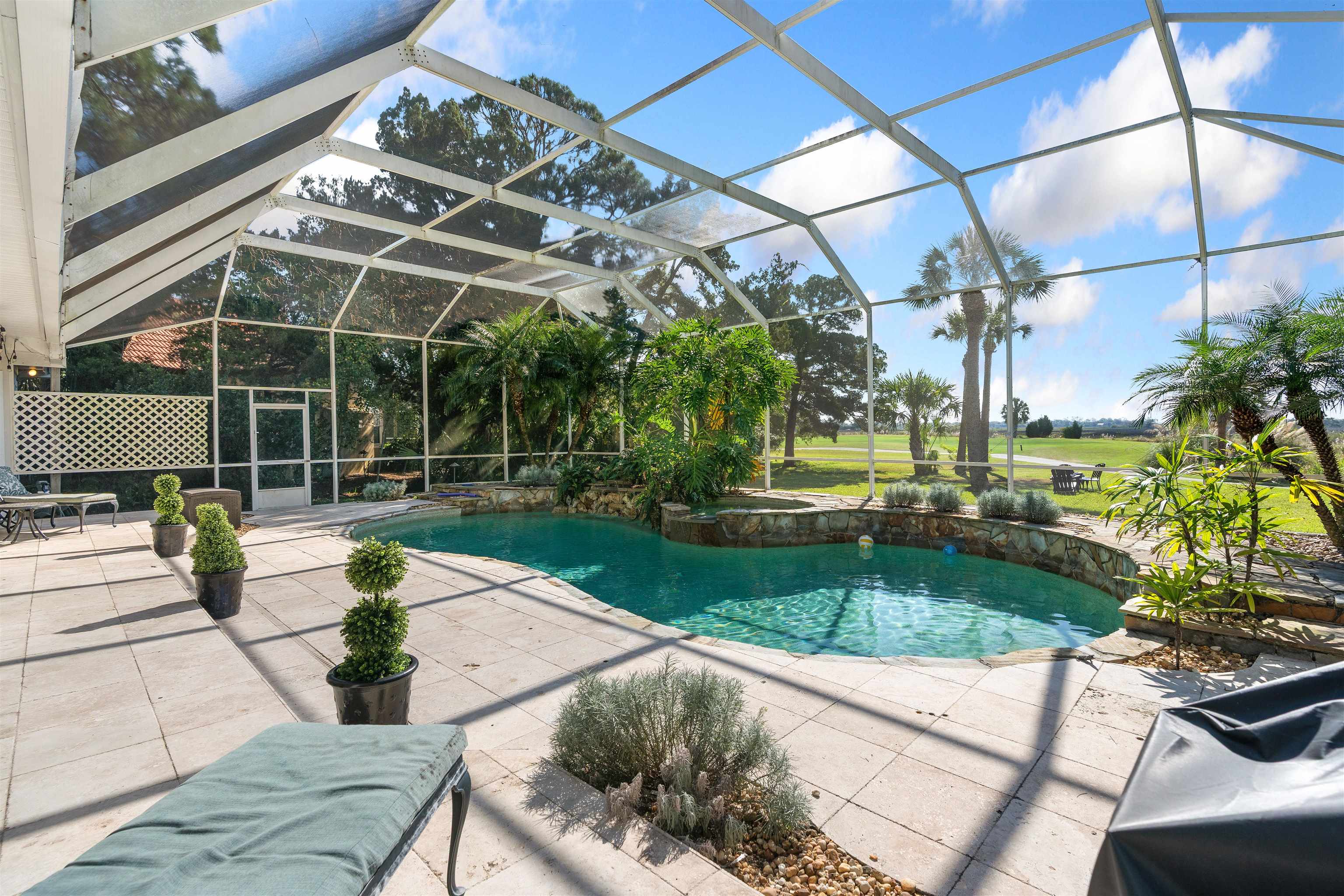 207 Marshside Drive St. Augustine, FL 32080 - Photo 56 of 87 View of pool featuring a sunroom, a lanai, a pool with connected hot tub, and a patio area
