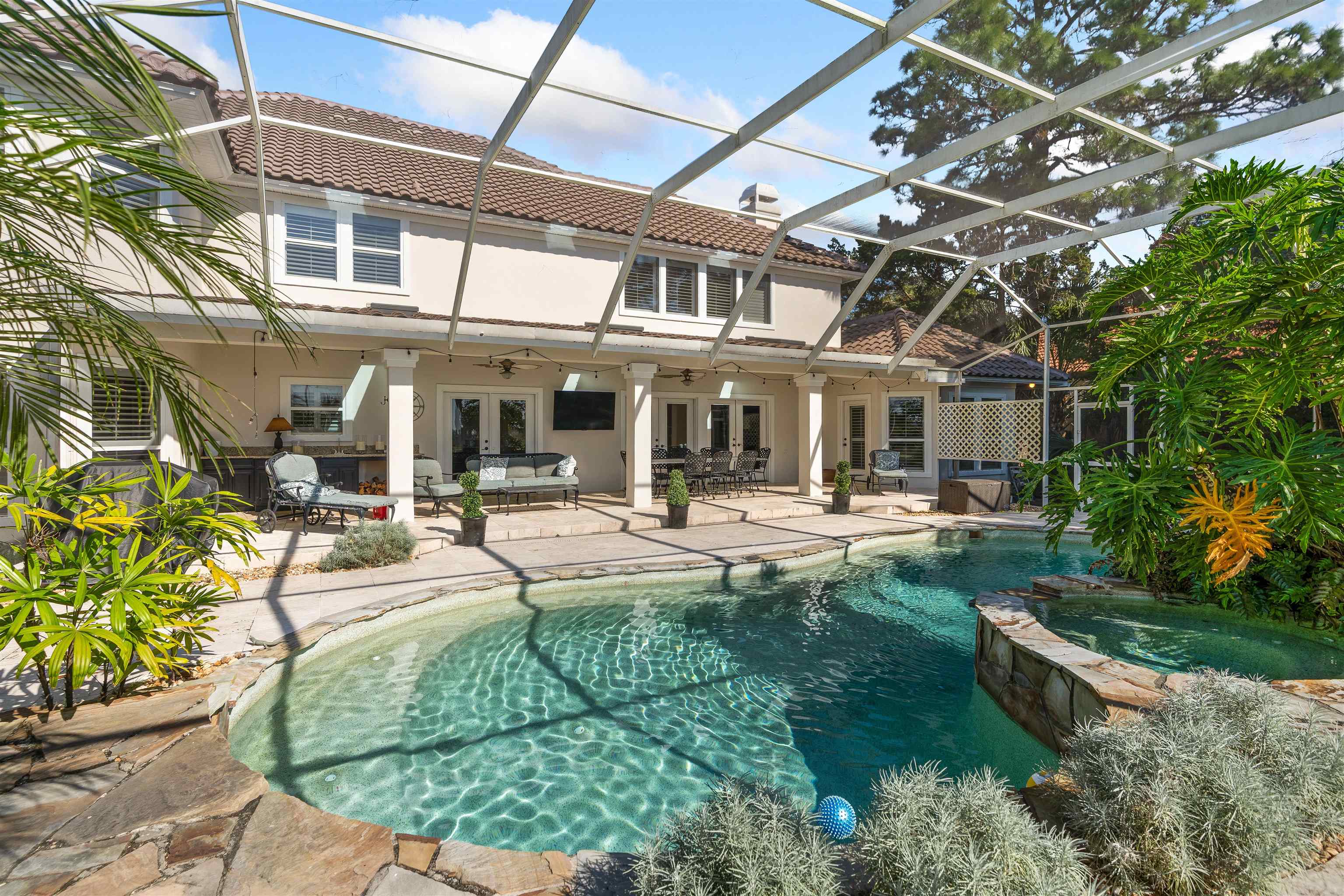 207 Marshside Drive St. Augustine, FL 32080 - Photo 57 of 87 a view of a house with sitting area and garden