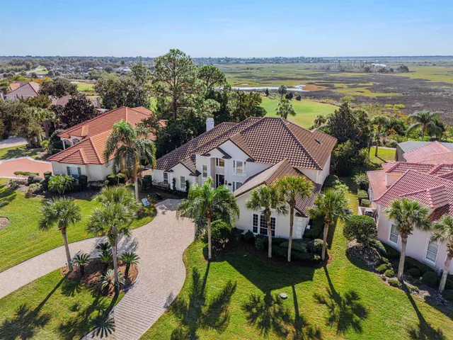 an aerial view of a house with a garden