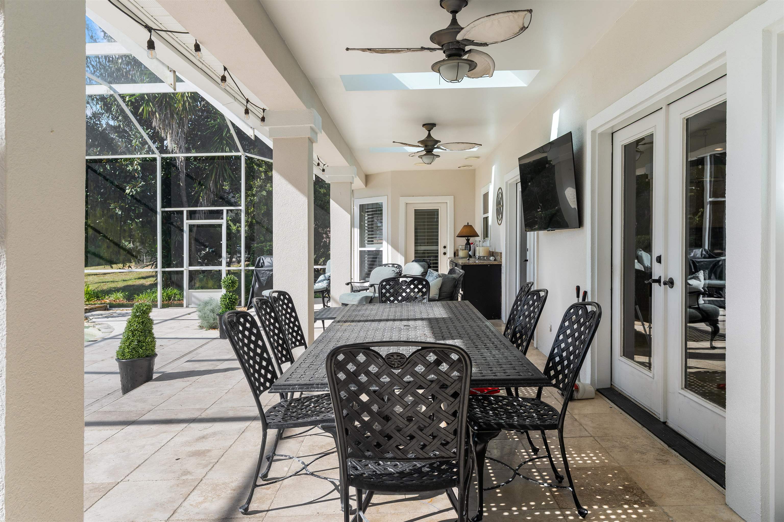 207 Marshside Drive St. Augustine, FL 32080 - Photo 61 of 87 a view of a dining room with furniture window and wooden floor