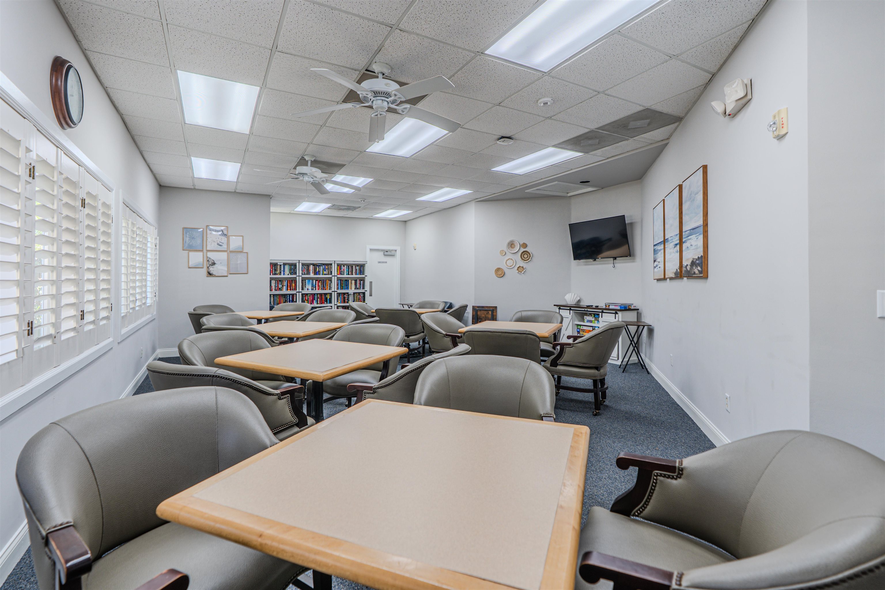 207 Marshside Drive St. Augustine, FL 32080 - Photo 67 of 87 a media room with lots of chairs and a projector screen