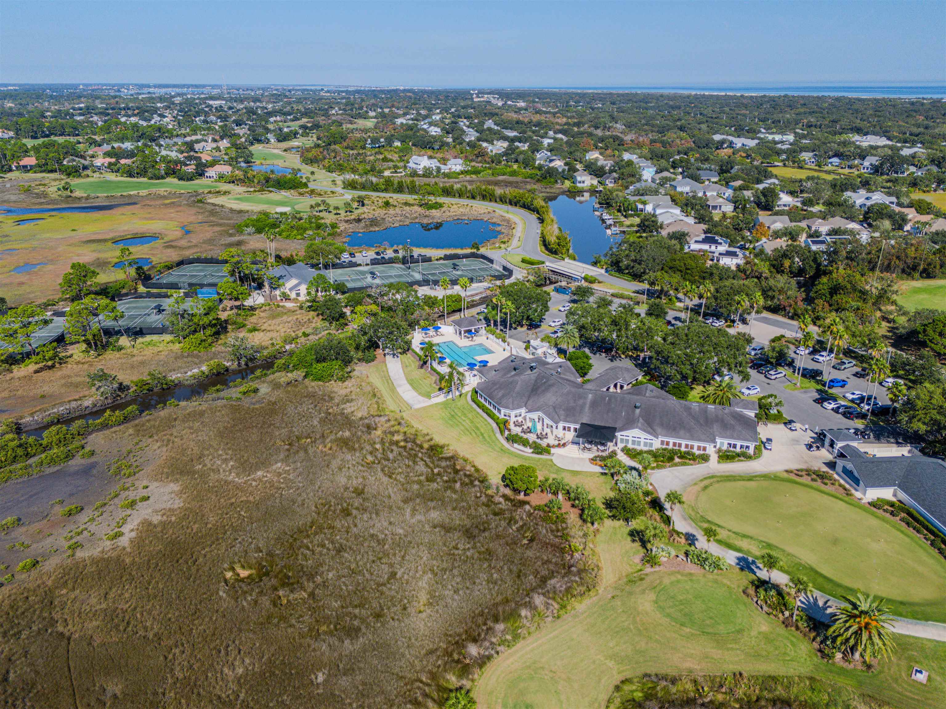 207 Marshside Drive St. Augustine, FL 32080 - Photo 77 of 87 Aerial overview of property's location featuring nearby suburban area, a golf club, and a large body of water