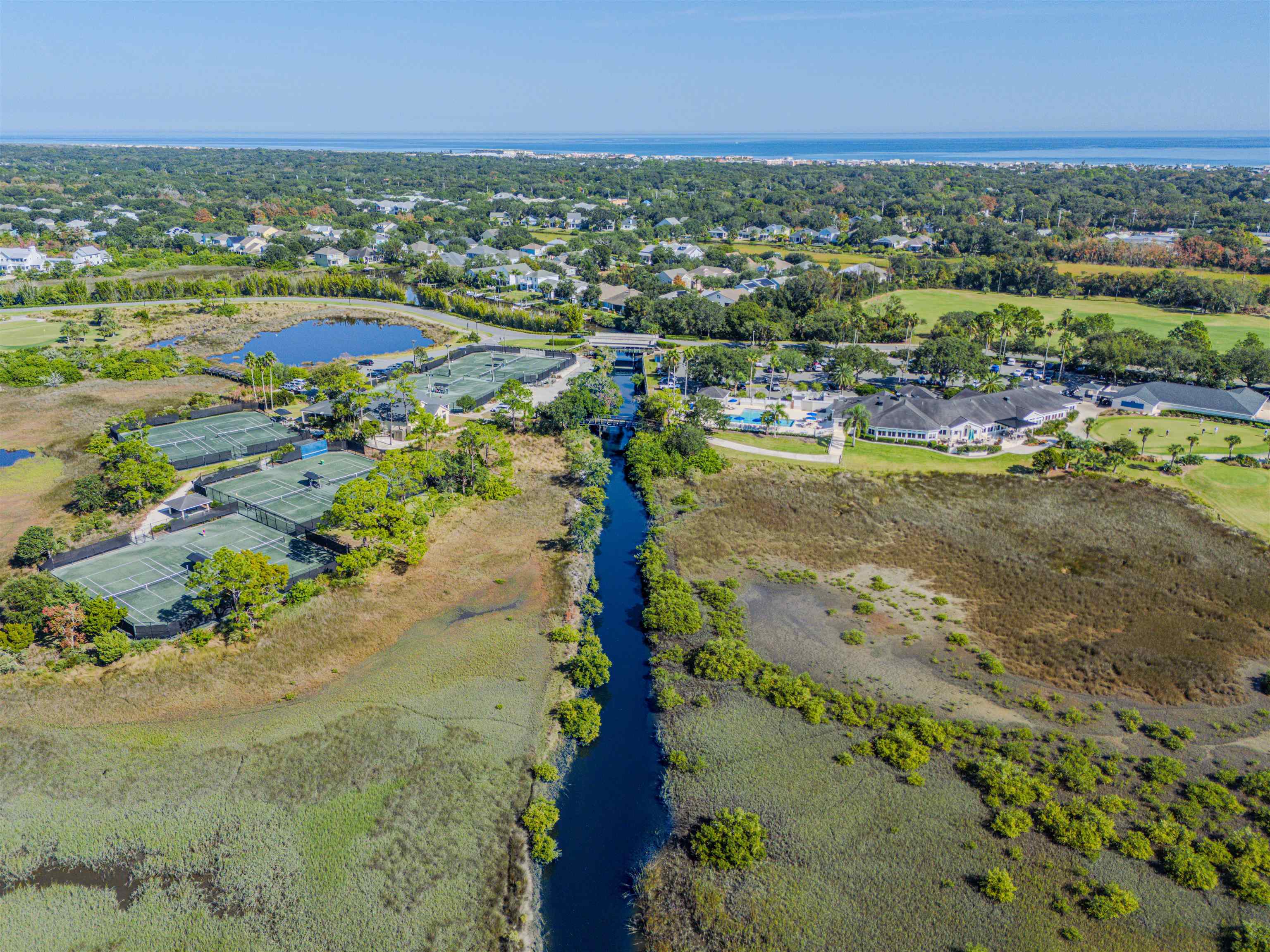 207 Marshside Drive St. Augustine, FL 32080 - Photo 81 of 87 Aerial view of residential area featuring a large body of water and a tree filled landscape