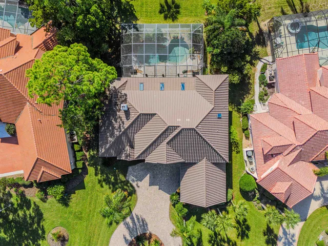 a living room with furniture a fireplace and a chandelier
