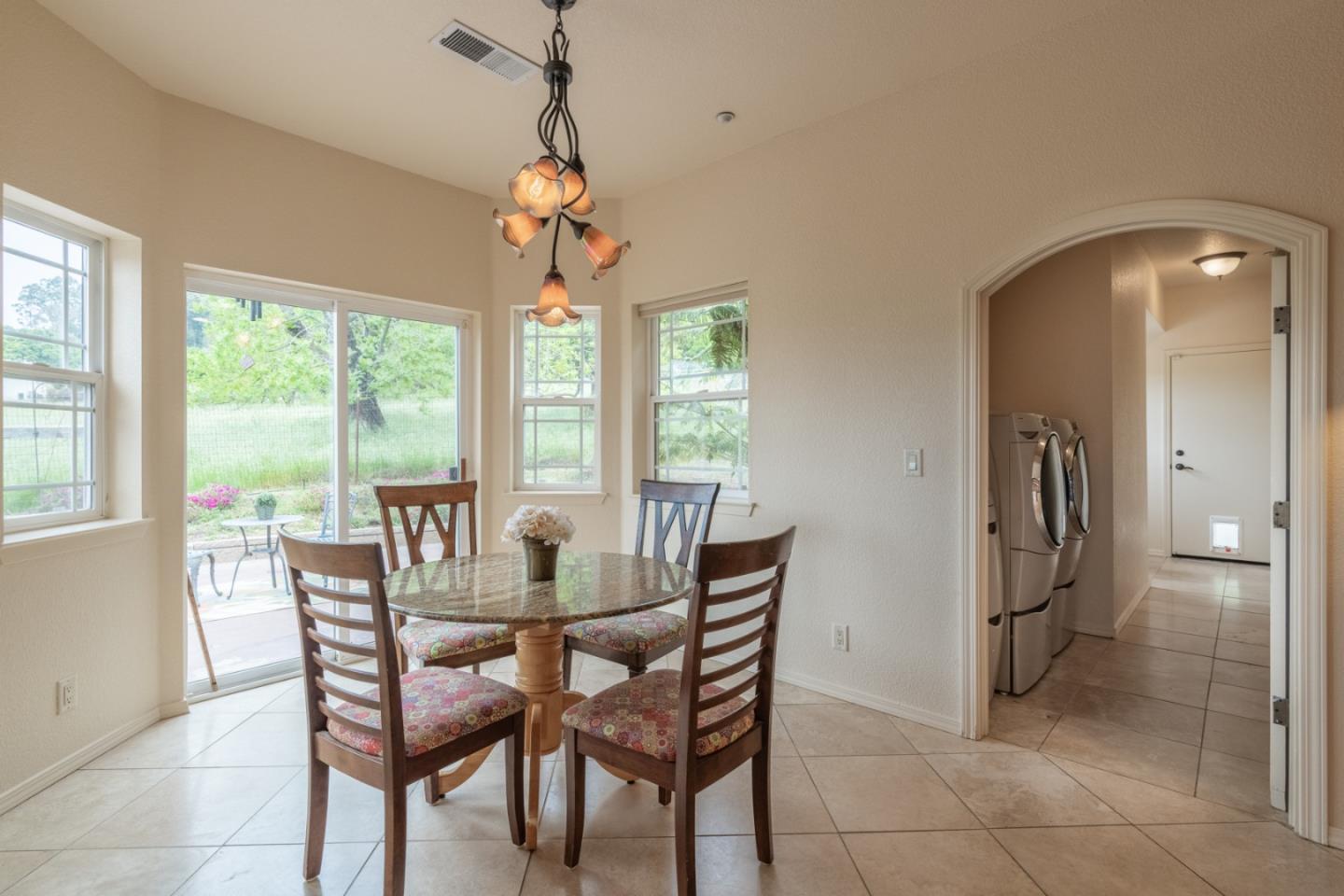 10233 Reese Circle Salinas, CA 93907 - Photo 13 of 49 a view of a dining room with furniture window and outside view