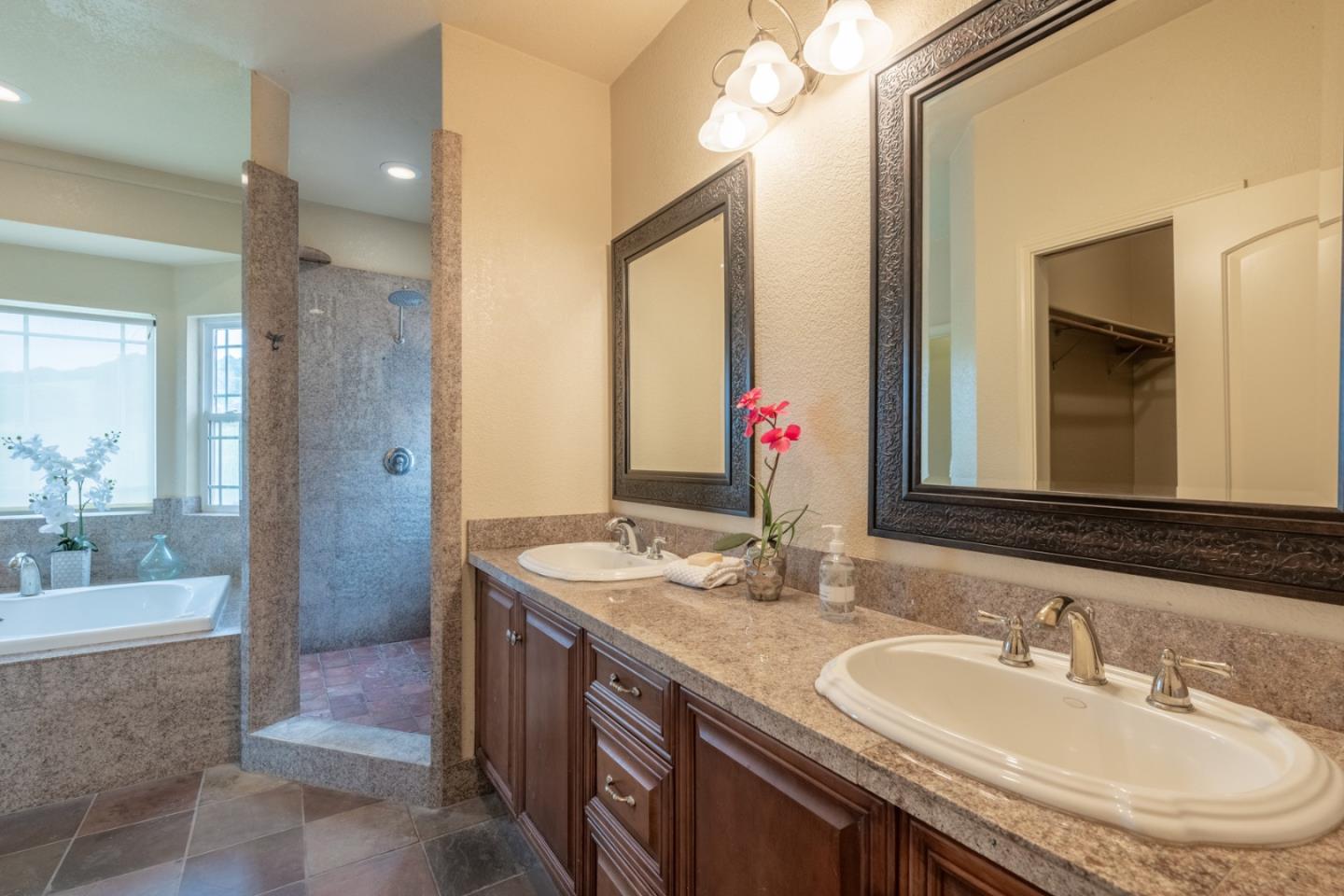 10233 Reese Circle Salinas, CA 93907 - Photo 16 of 49 a bathroom with a granite countertop double vanity sink and a mirror