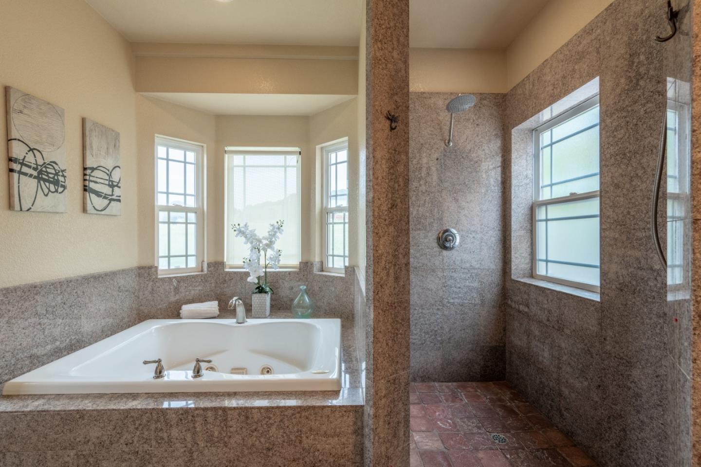 10233 Reese Circle Salinas, CA 93907 - Photo 18 of 49 a bath tub sitting in a bathroom next to a window