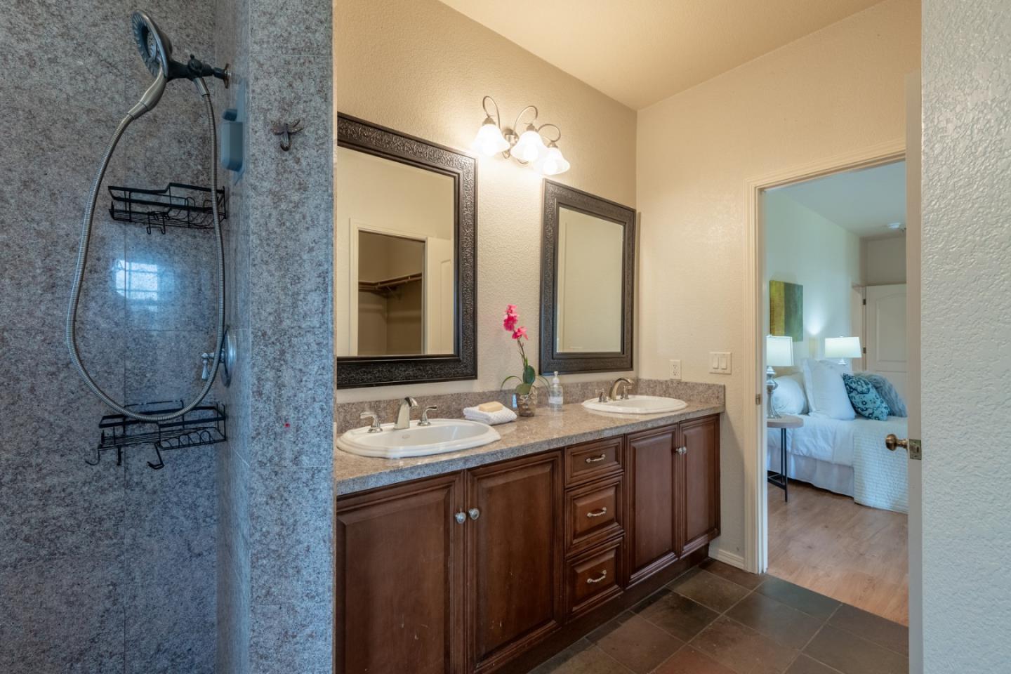 10233 Reese Circle Salinas, CA 93907 - Photo 20 of 49 a spacious bathroom with a double vanity sink a mirror and shower