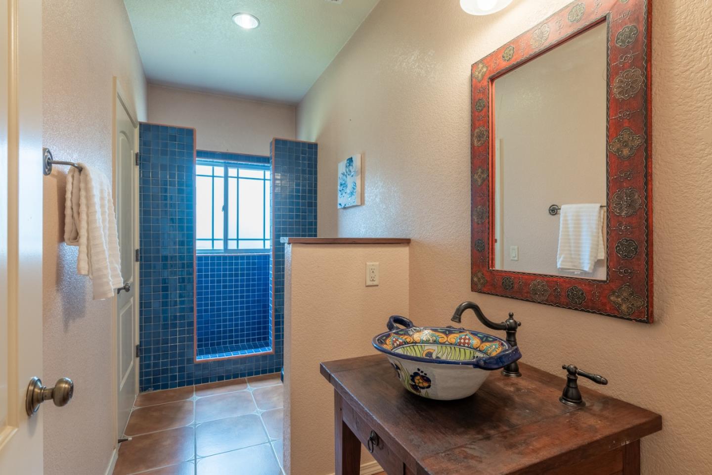 10233 Reese Circle Salinas, CA 93907 - Photo 22 of 49 a view of a hallway with dining room and chandelier