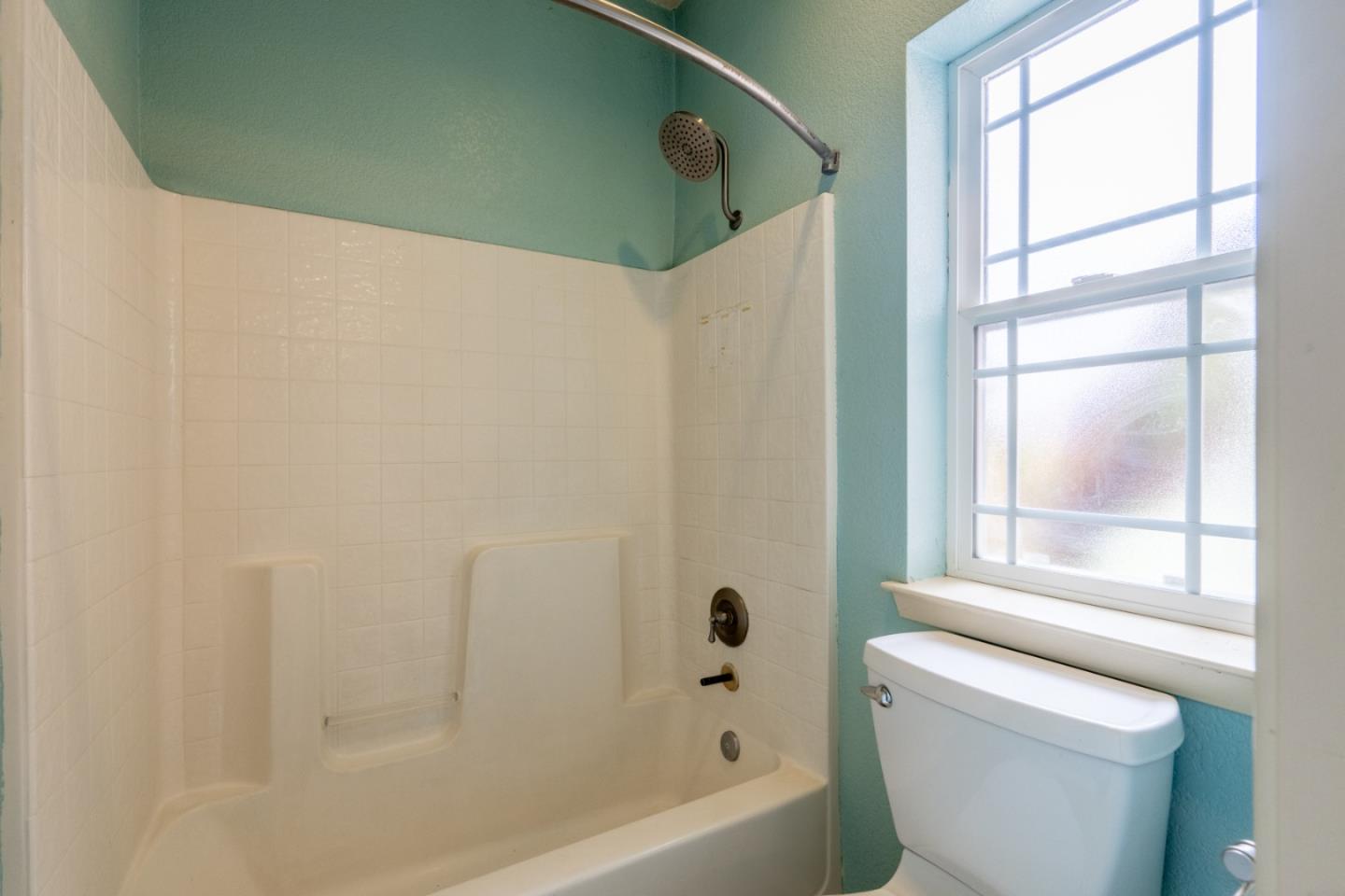 10233 Reese Circle Salinas, CA 93907 - Photo 26 of 49 a bathroom with a bathtub a window and a shower