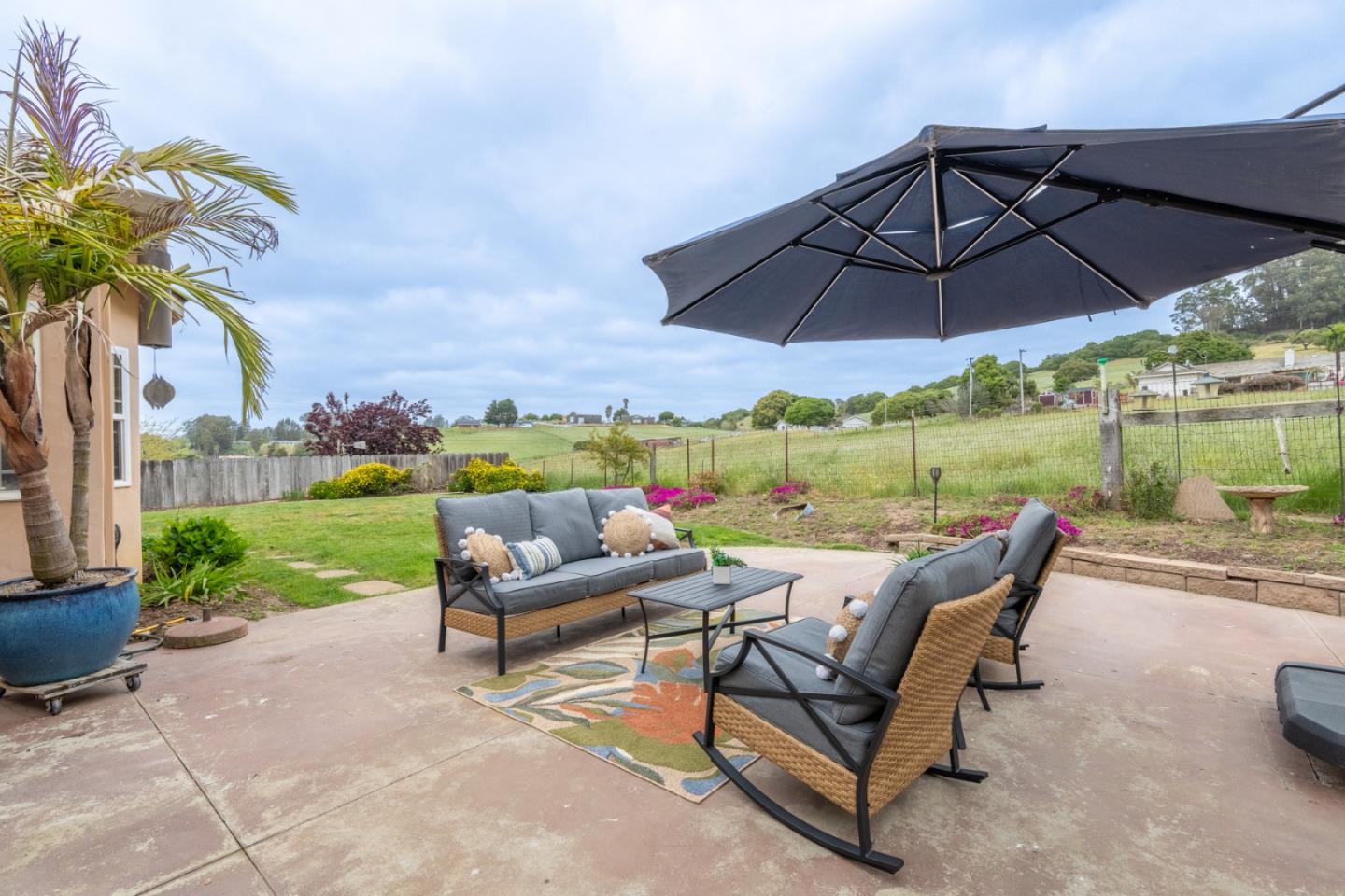 10233 Reese Circle Salinas, CA 93907 - Photo 29 of 49 a view of a tables and chairs under an umbrella