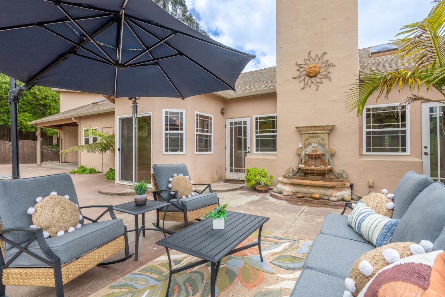 10233 Reese Circle Salinas, CA 93907 - Photo 31 of 49 a outdoor living area with furniture and a umbrella