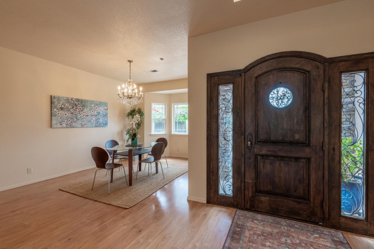 10233 Reese Circle Salinas, CA 93907 - Photo 5 of 49 a view of a hallway with wooden floor and furniture