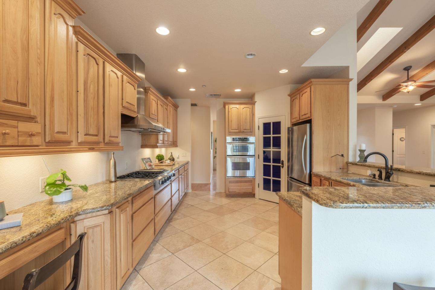 10233 Reese Circle Salinas, CA 93907 - Photo 10 of 49 a kitchen with stainless steel appliances granite countertop a sink and a stove