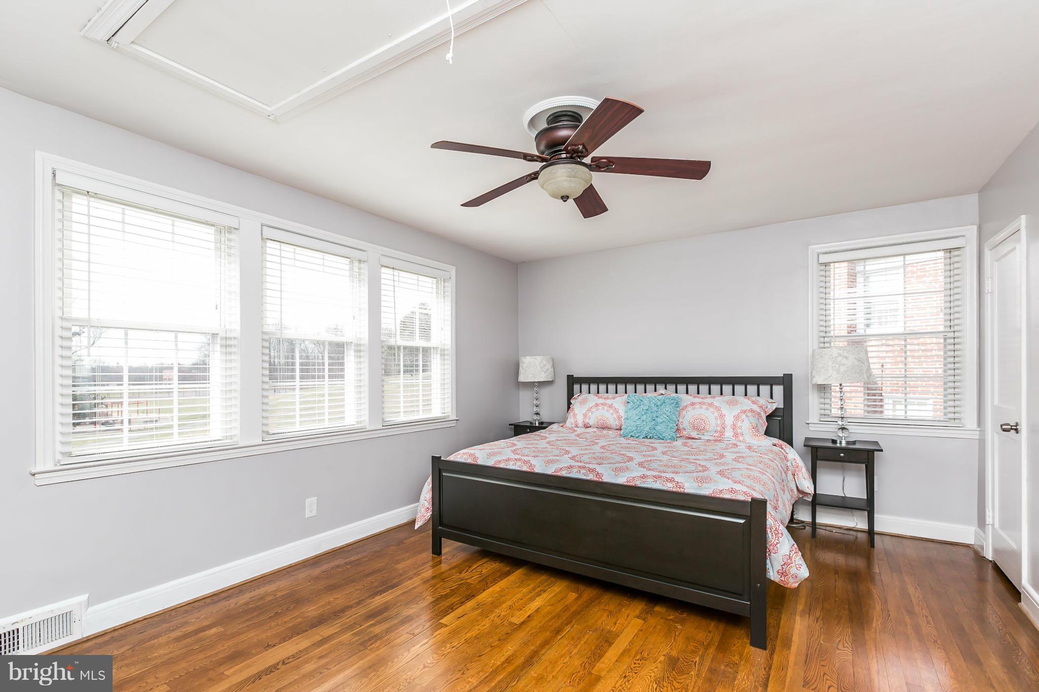 1947 Edgewood Road Baltimore, MD 21286 - Photo 16 of 28 a bedroom with a bed and wooden floor